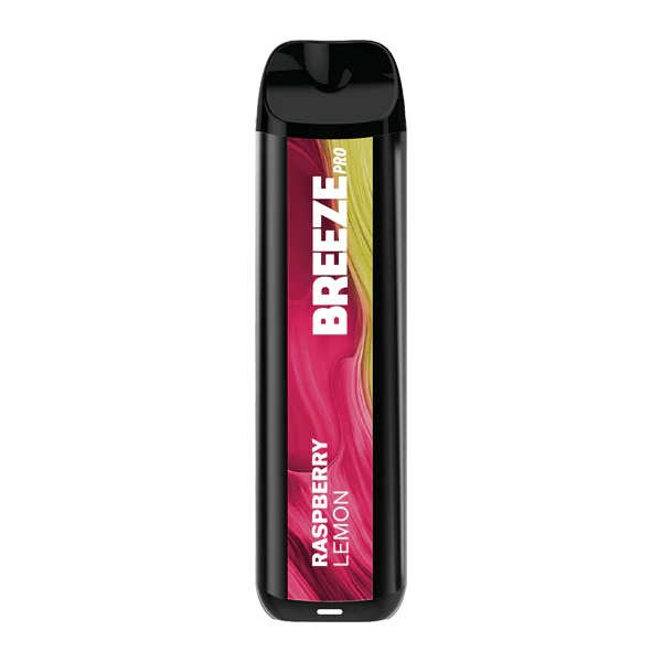 A close-up of a stamp pink disposable vape device with pink gradient finish, held by a hand in natural light